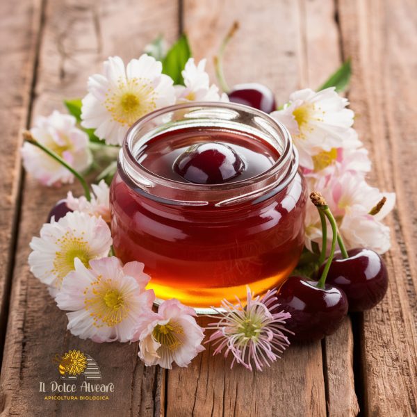 Barattolo di Miele di Ciliegio e Asfodelo su sfondo di fiori di ciliegio e asfodelo